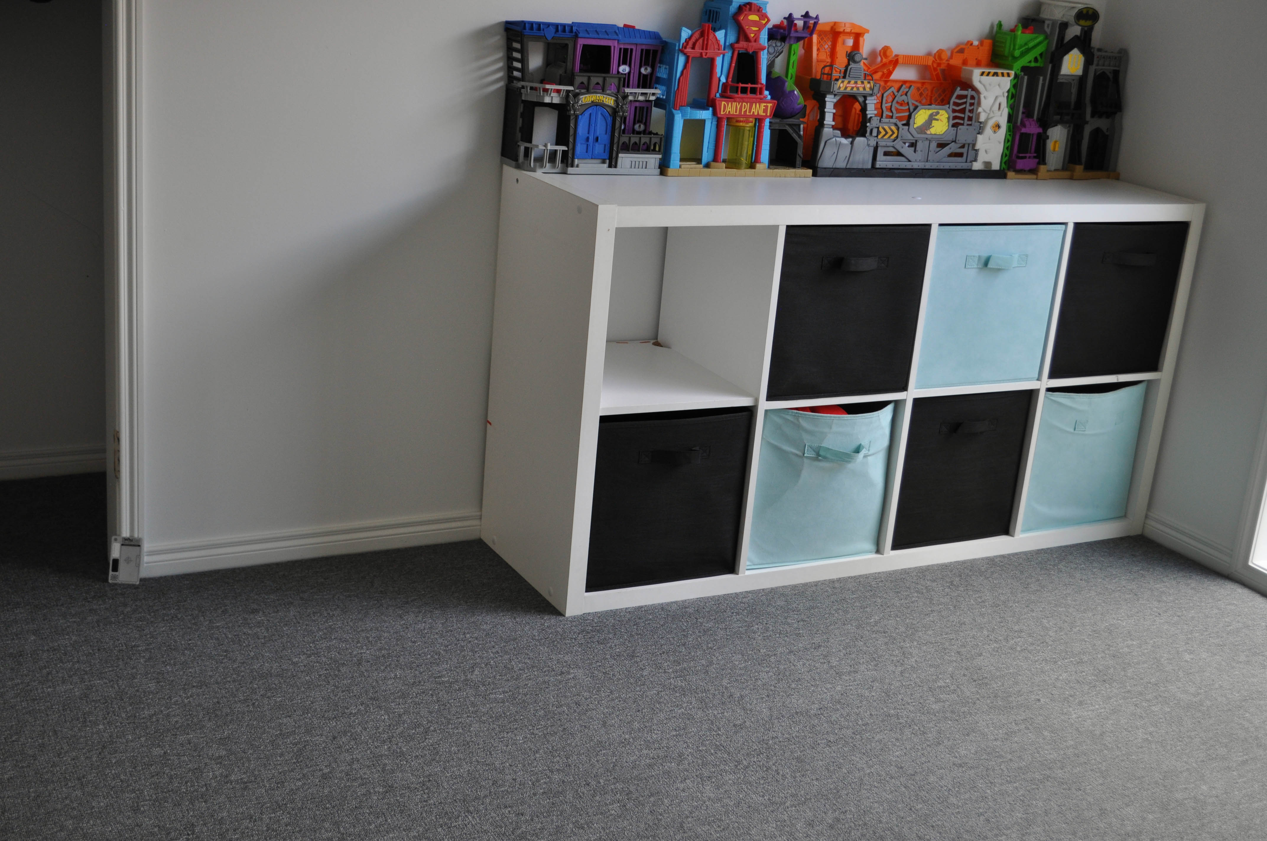 a grey colored carpet installed by Concord Floors, in a room in caroline Springs.