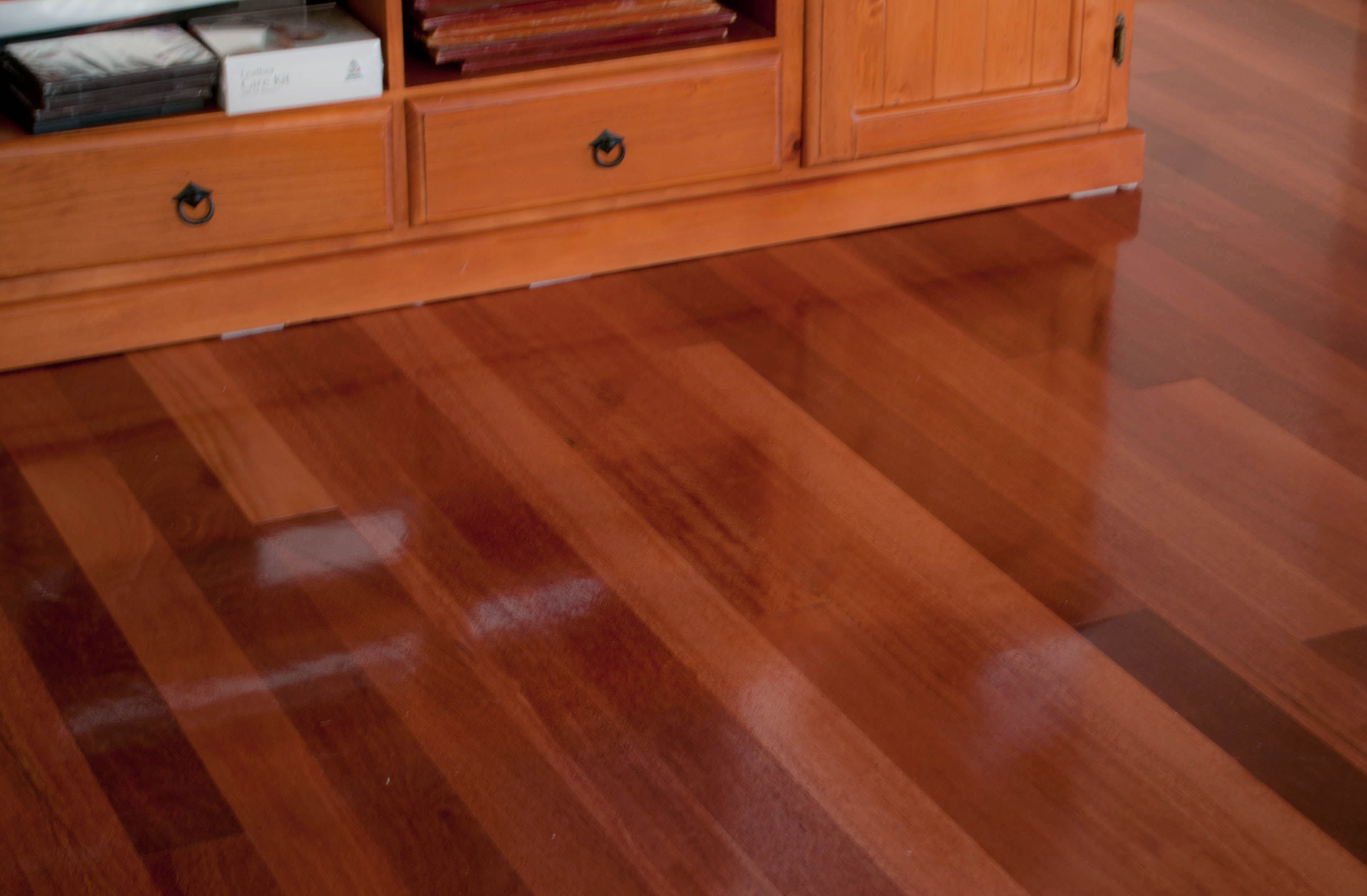 showing a room with a newly laid West Australian Karrie solid timber floor in a house. The floor is an red-orangey color