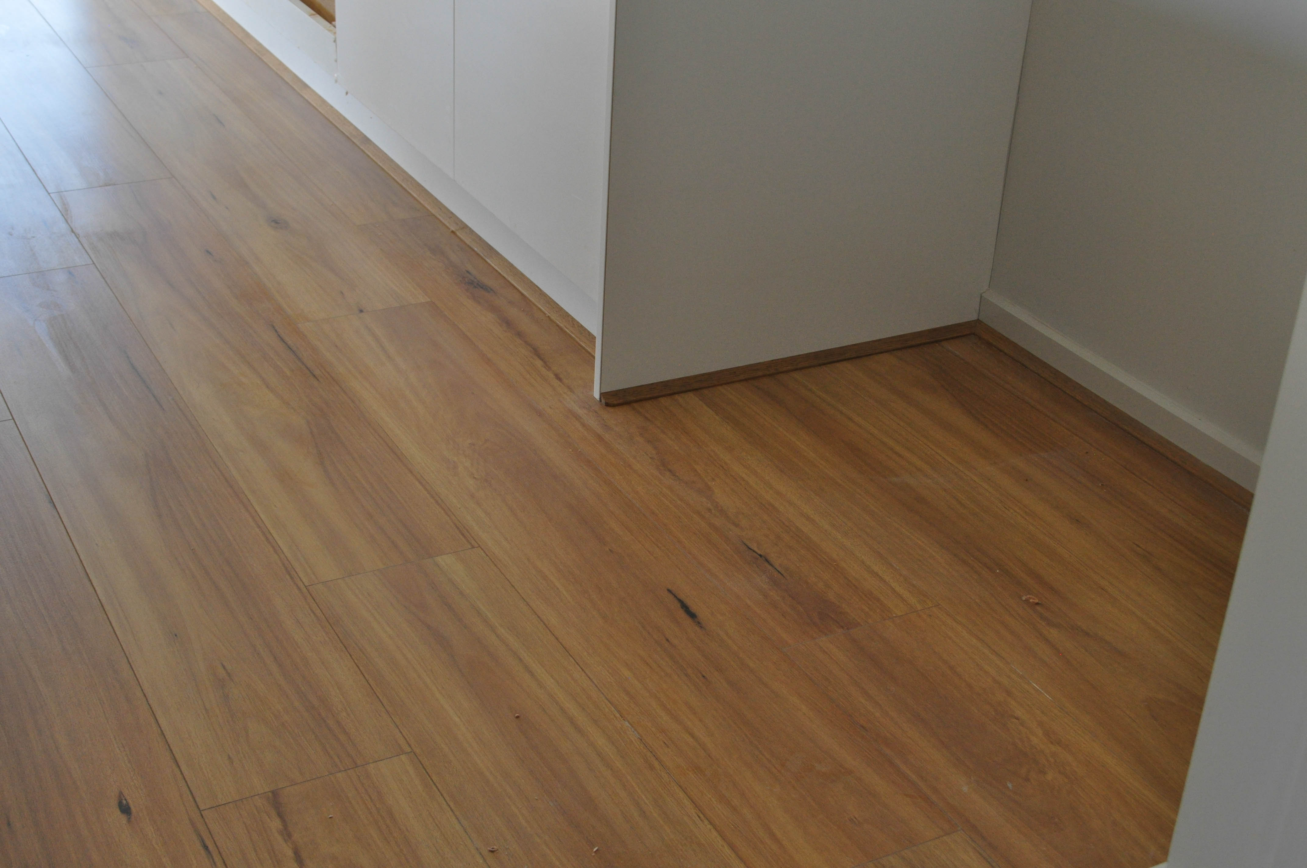 The laminate flooring installation in a kitchen in Werribee by Concord floors.