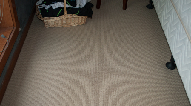 pink colored, sisal-pile carpet installed in a room in the suburb of Melton Vic 3337 by Concord Floors.